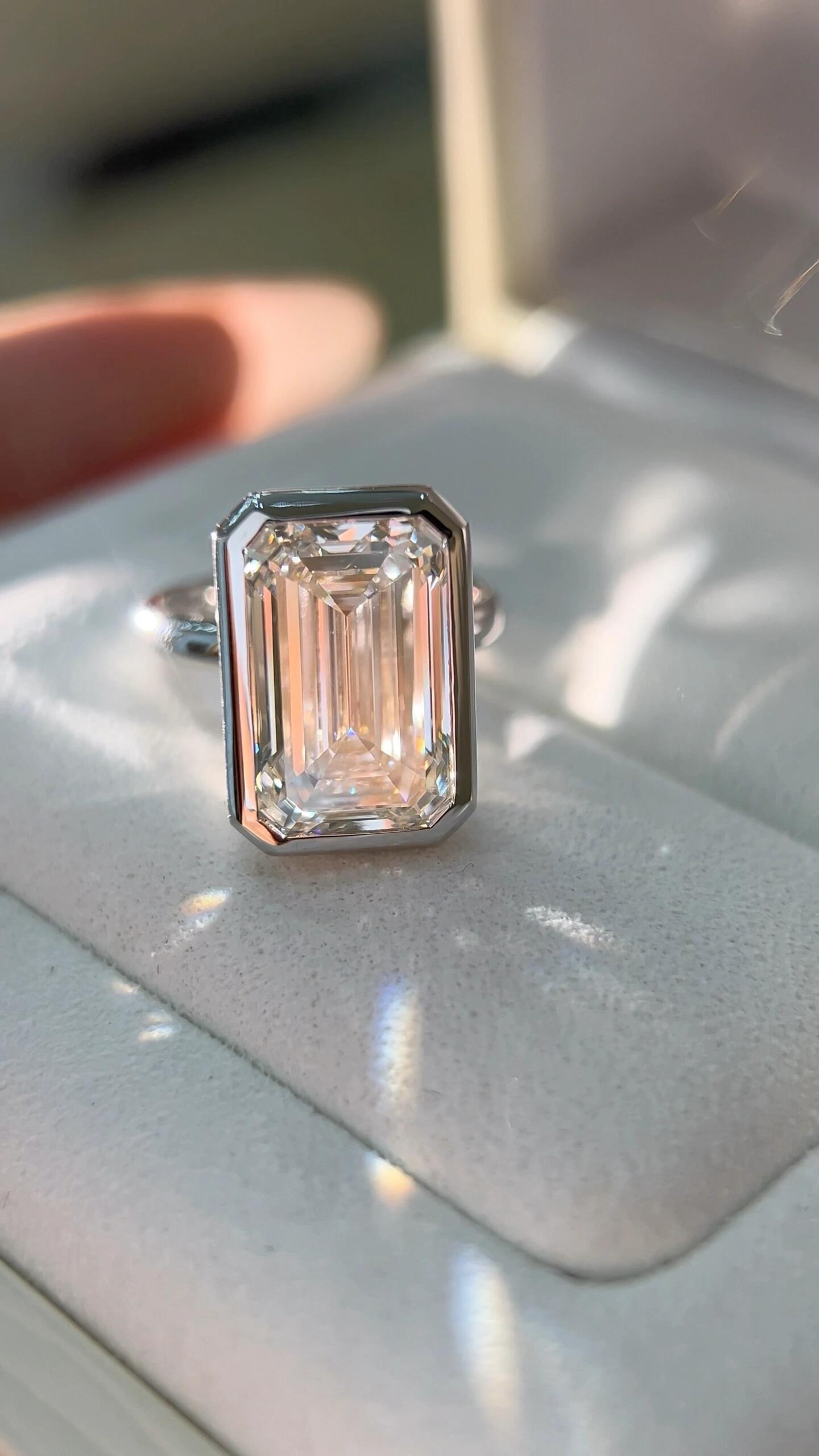Emerald-cut bezel setting with clean, protective edge