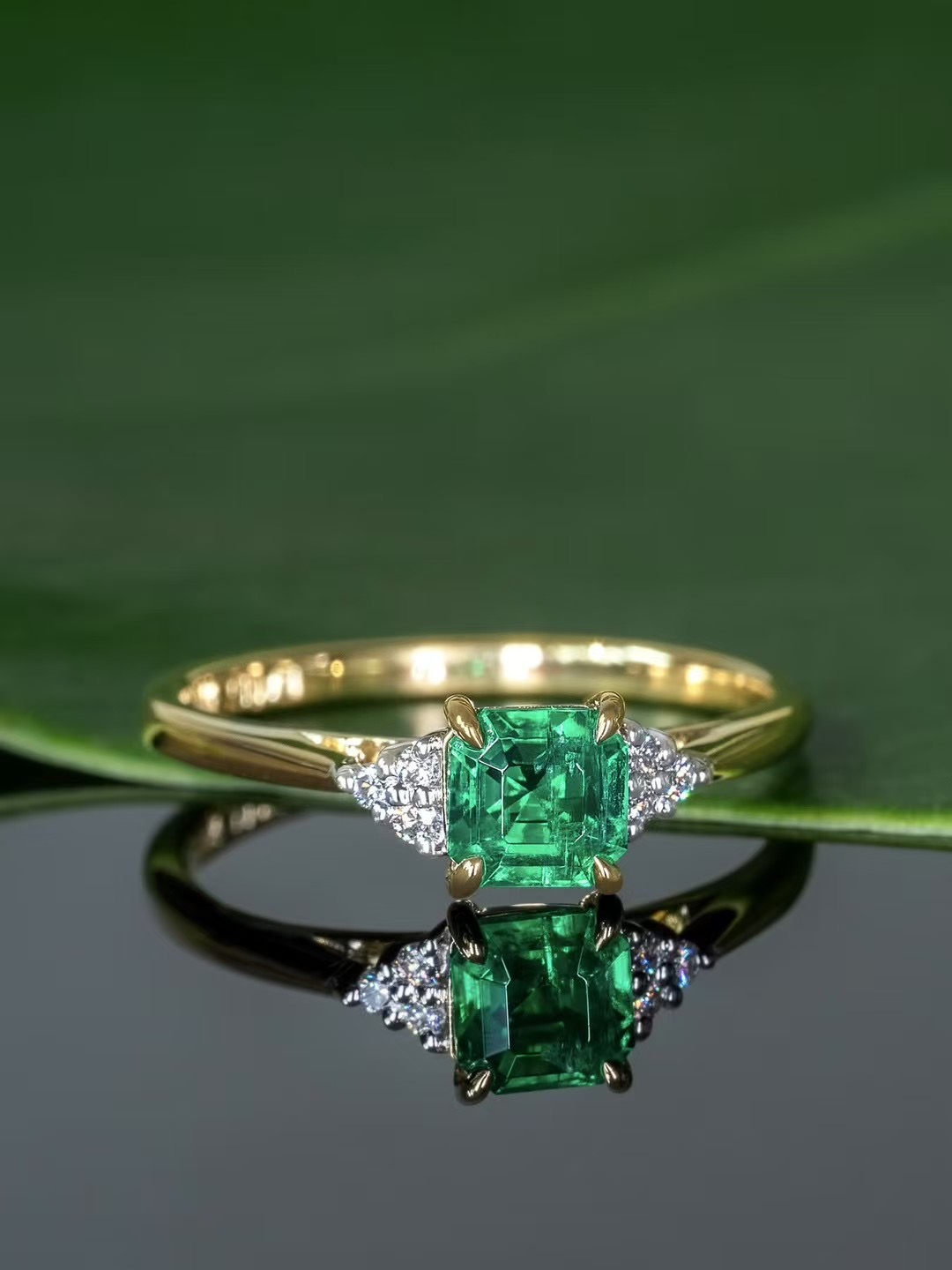 Emerald Ring with Yellow Gold Band and Side Diamonds