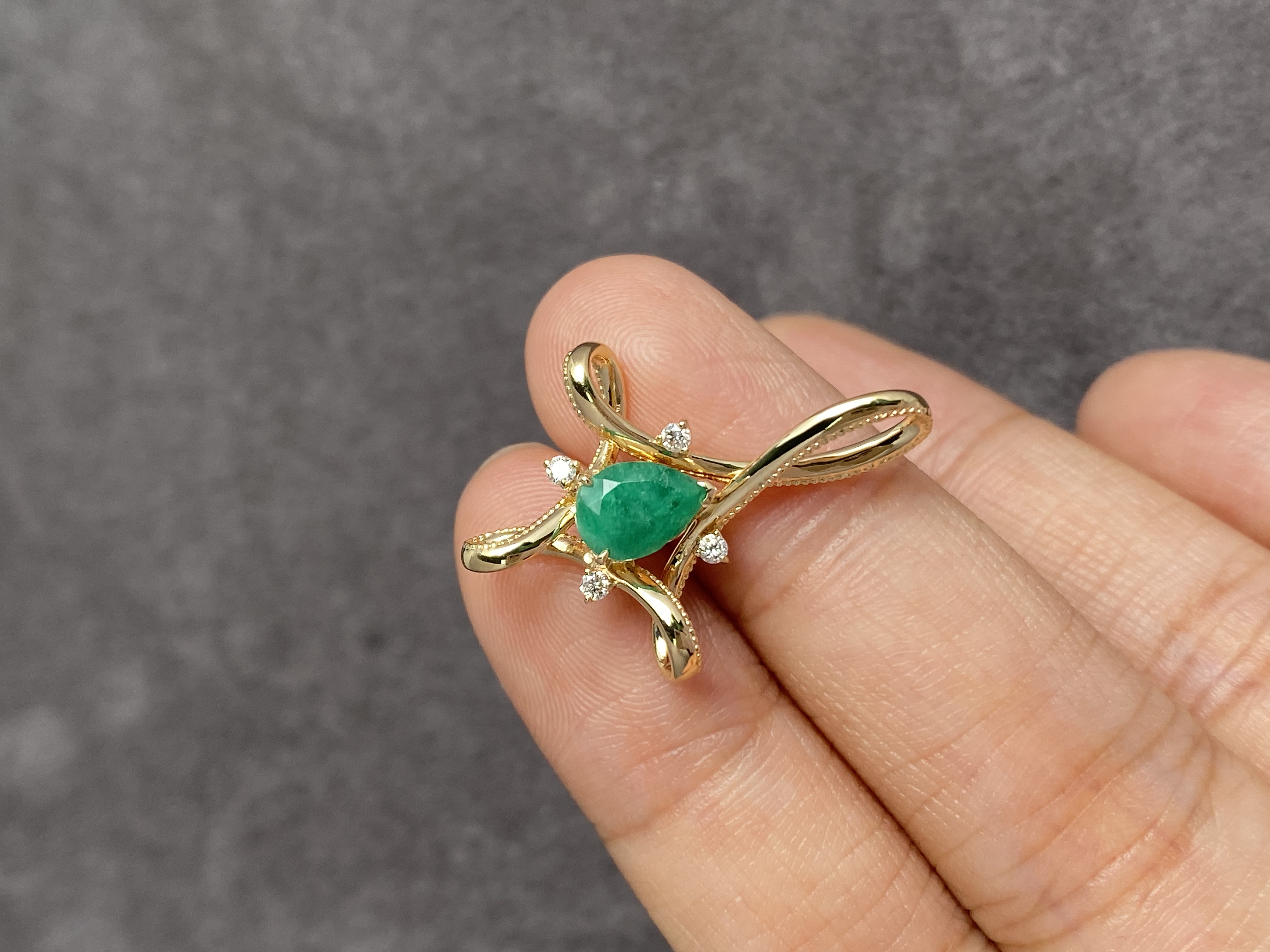 Finished custom pendant in hand